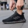 Popular men's breathable flying woven sneakers casual mesh shoes Popcorn sole running shoes 39-44